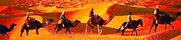 真っ赤に染める夕日のなか次のオアシスに向かう駱駝商隊。